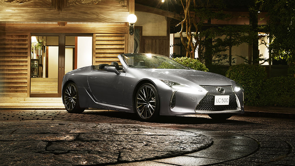 Lexus LC Convertible parked in a driveway at night