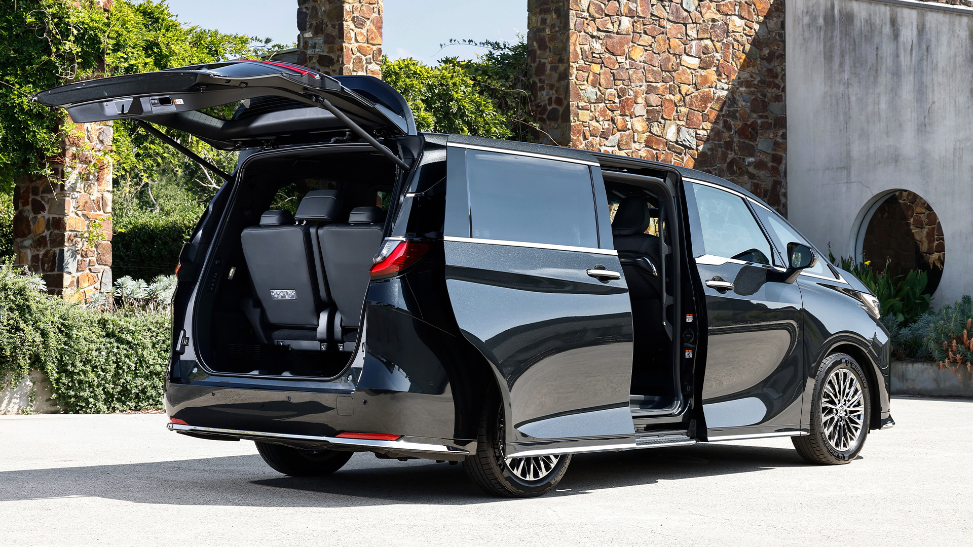 Black Lexus LM mover with boot and doors open