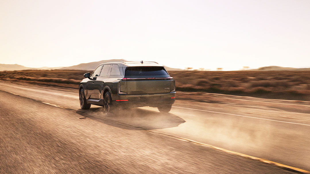 Lexus TZ driving along a dusty road