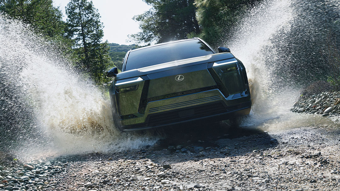Lexus TZ driving through a large puddle of water